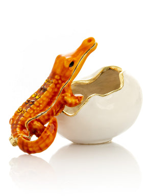 Orange Crocodile hatching from egg