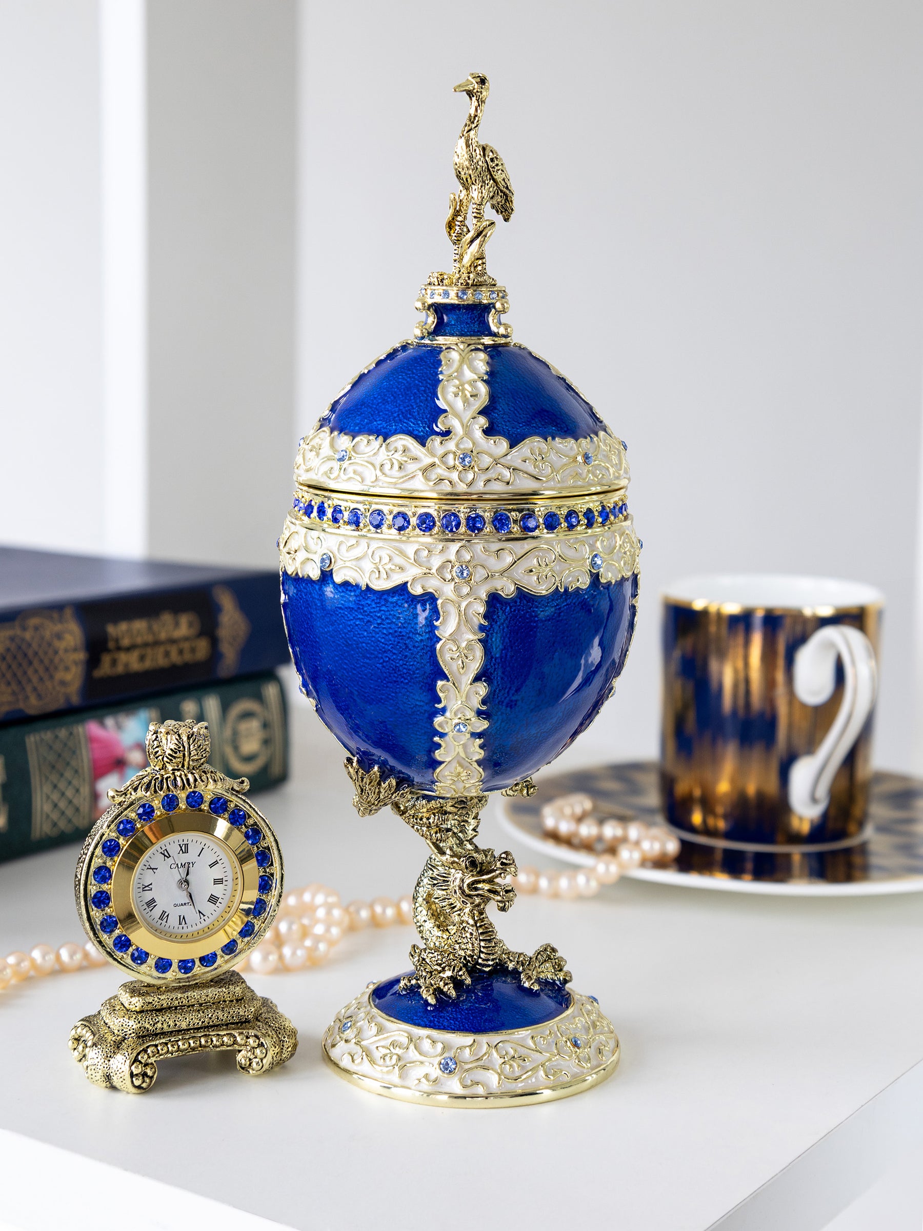 Luxurious Blue-Gold Egg with Clock with Dragon Pedestal and Bird Ornament