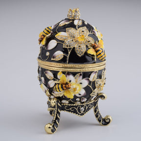 Oeuf de Fabergé noir décoré d'abeilles et de fleurs