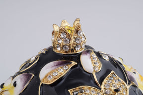 Oeuf de Fabergé noir décoré d'abeilles et de fleurs