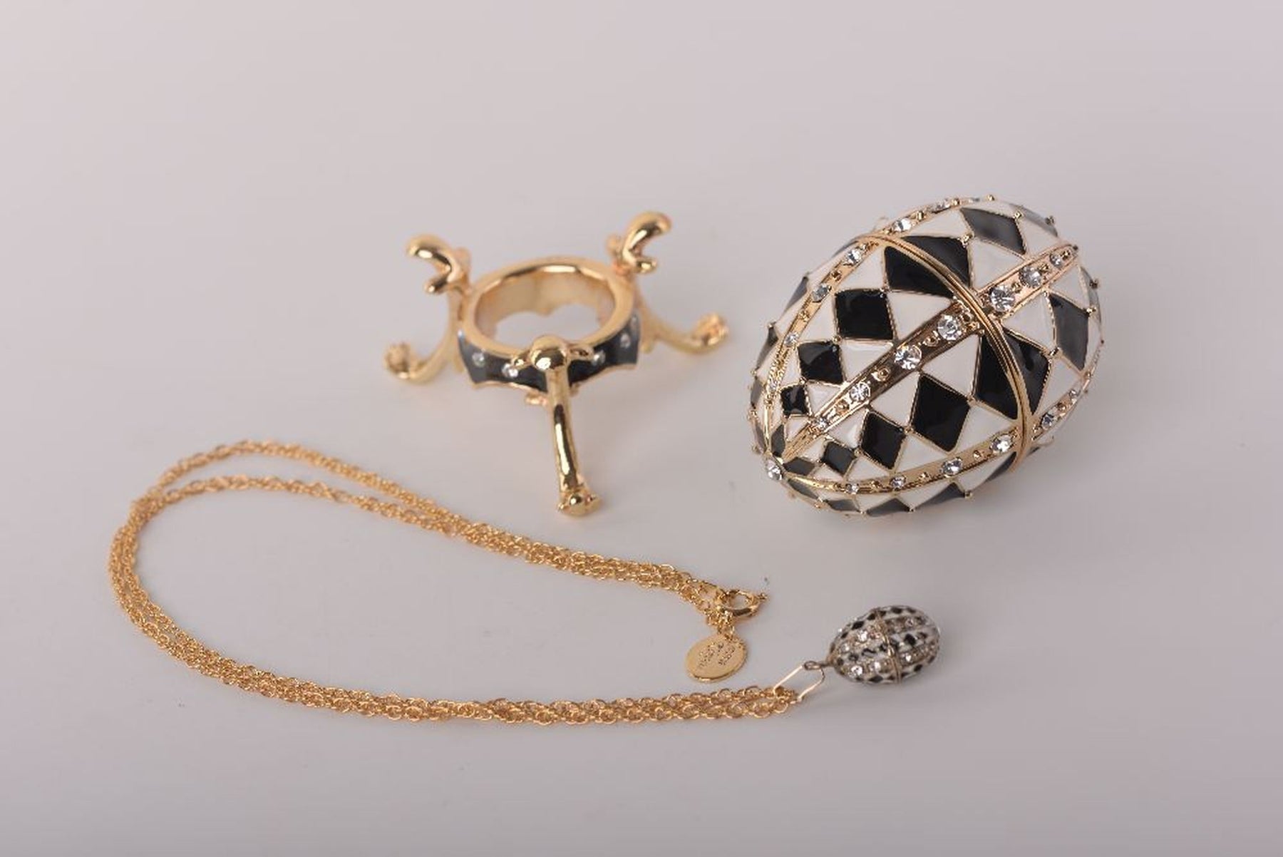 Black and White Faberge Egg with Gold Necklace Inside